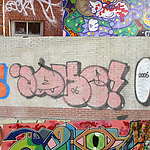 Een tag (Bern), een character (Oase), een throw-up (Jake) en een piece (Mickey) op verschillende plaatsen in Amsterdam.