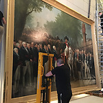 De herplaatsing van ‘De intocht van Napoleon te Amsterdam’ na restauratie