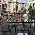 View from the conference venue, fenches and police at the place where the demonstrations took place. On the wall election posters for Erdogan's AK party. photo Annemarie de Wildt