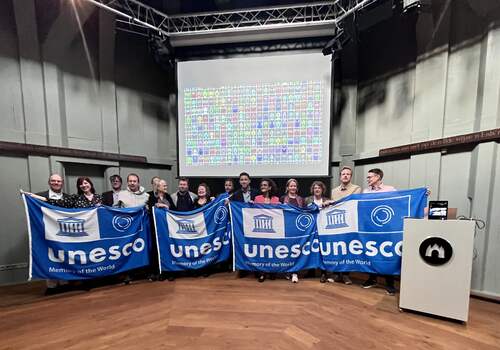 Uitreiking UNESCO-vlag in De Waag